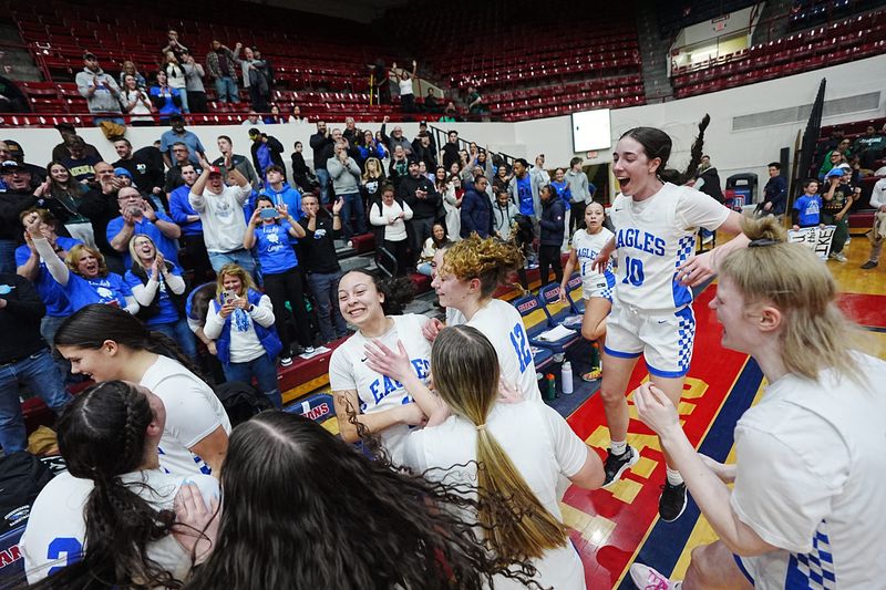 Utica Eisenhower celebrates their win over Fraser during the MHSAA Girls basketball division 1 quarterfinals at Calihan Hall in Detroit, Tuesday, March 17, 2026.