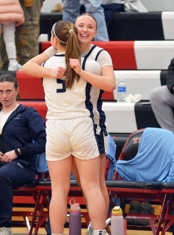 Petoskey sophomore Lyla Janes (5) embraces senior Lauren LaHaie in the final moments of a Division 2 quarterfinal loss to Flint Powers Catholic on Wednesday, March 18.