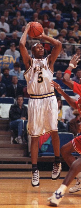 The University of Michigan's Jalen Rose puts up a jumper against the University of Detroit Mercy Dec. 6, 1993.