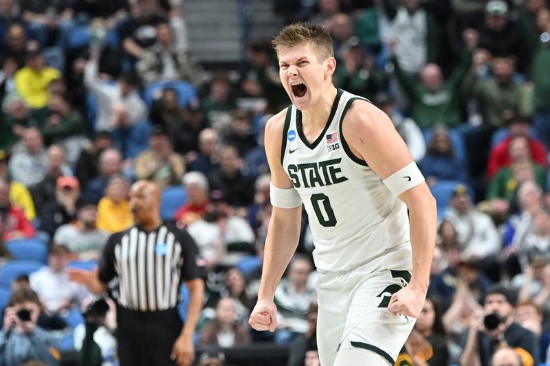 Mar 19, 2026; Buffalo, NY, USA; Michigan State Spartans forward Jaxon Kohler (0) reacts to a play during the first half against the North Dakota State Bison during a first round game of the men's 2026 NCAA Tournament at Keybank Center. Mandatory Credit: Mark Konezny-Imagn Images