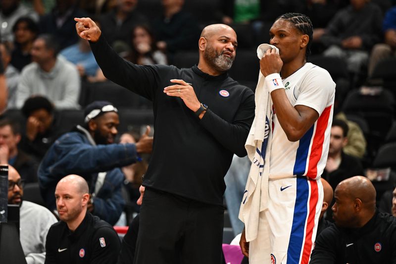 Detroit Pistons head coach J.B. Bickerstaff talks with guard Ausar Thompson (9) against the Washington Wizards during the first half at Capital One Arena in Washington on Thursday, March 19, 2026.