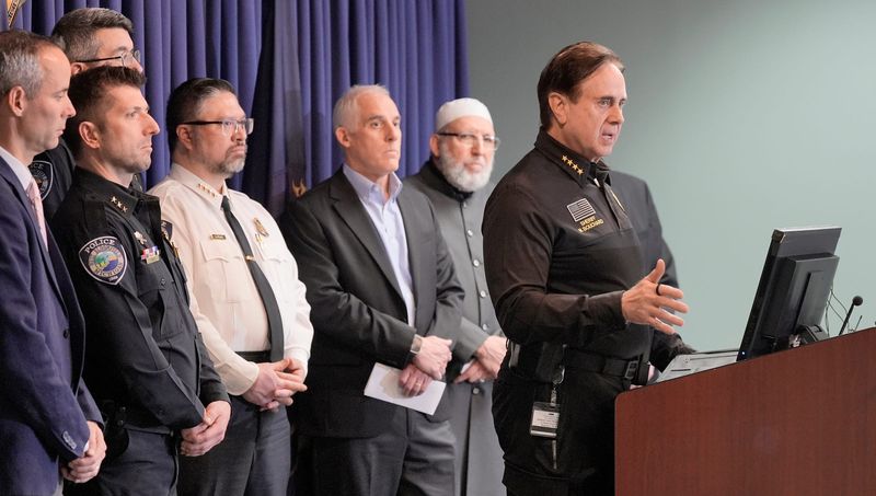 Sheriff Michael Bouchard talks with the media as faith leaders and police officers listen behind him during a press conference at the Oakland County Sheriff's Office in Pontiac on Thursday, March 19, 2026.