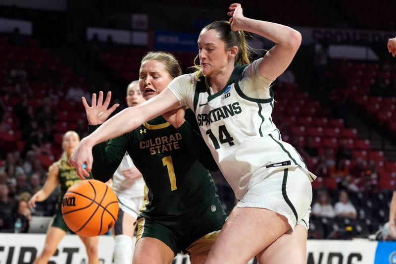 Michigan State Spartans forward Grace Vanslooten (14) reaches for the ball beside Colorado State Rams guard Kloe Froebe (1) during a first-round game in the NCAA women's basketball tournament between the Colorado State Rams and the Michigan State Spartans at Lloyd Noble Center in Norman, Okla., Friday, March 20, 2026.