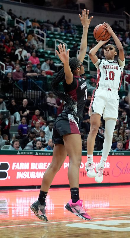 Muskegon (10) Mariah Anionette Sain hits the jumper over Detroit Renaissance (12) in the second half on their way to a 34-29 win in the MHSAA Division 1 girls basketball finals at the Breslin Center in East Lansing on Saturday, March 21, 2026.