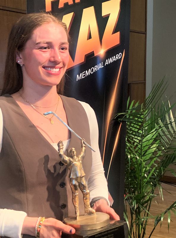 Wisconsin defender Caroline Harvey poses with the Patty Kazmaier trophy after winning the award Saturday March 21, 2026 at the HUB-Robeson Center’s Alumni Hall on the campus of Penn State University.
