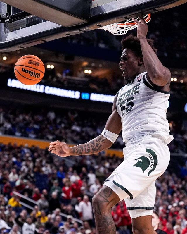 Michigan State forward Coen Carr (55) dunks against Louisville during the second half of NCAA Tournament Second Round at KeyBank Center in Buffalo on Saturday, March 21, 2026.