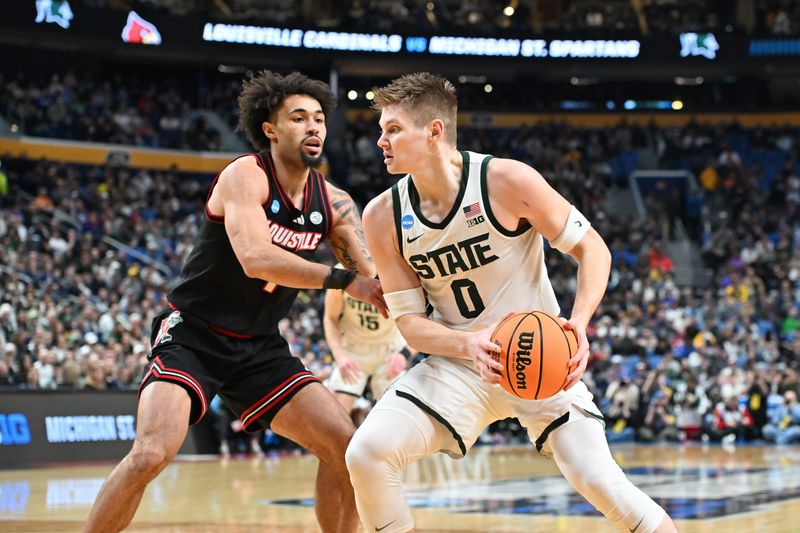 Mar 21, 2026; Buffalo, NY, USA; Michigan State Spartans forward Jaxon Kohler (0) moves the ball in the first half against the Louisville Cardinals during a second round game of the men's 2026 NCAA Tournament at Keybank Center. Mandatory Credit: Mark Konezny-Imagn Images