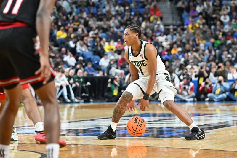 Mar 21, 2026; Buffalo, NY, USA; Michigan State Spartans guard Jeremy Fears Jr. (1) handles the ball during the first half against the Louisville Cardinals during a second round game of the men's 2026 NCAA Tournament at Keybank Center. Mandatory Credit: Mark Konezny-Imagn Images