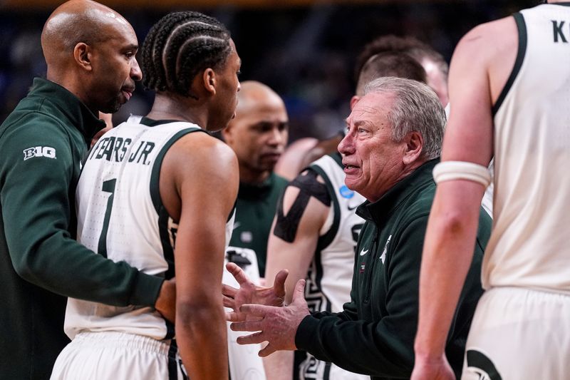 Michigan State head coach Tom Izzo talks to guard Jeremy Fears Jr. (1) at a timeout against Louisville during the second half of NCAA Tournament Second Round at KeyBank Center in Buffalo on Saturday, March 21, 2026.