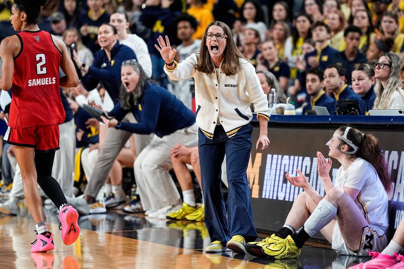Michigan head coach Kim Barnes Arico reacts to a play against N.C. State during the first half of NCAA Tournament Second Round at Crisler Center in Ann Arbor on Sunday, March 22, 2026.
