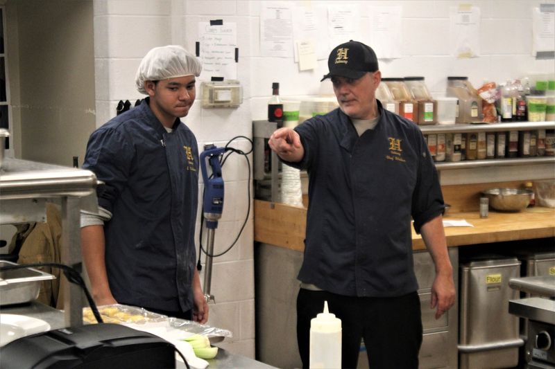 Chef Eric Walker (right) guides roughly 60 students in Howell High School's Culinary Arts Program, which includes juniors and seniors.