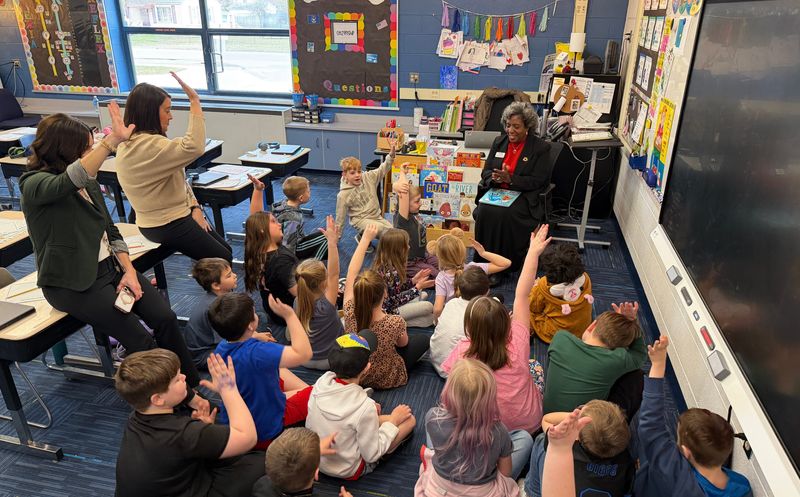 Dr. Corrinne Edwards (right), director of the Michigan Department of Education Office of Educational Supports, reads to students in Ms. Sara Kawala’s second grade class on March 24, 2026, at Morton Elementary School in Marysville.