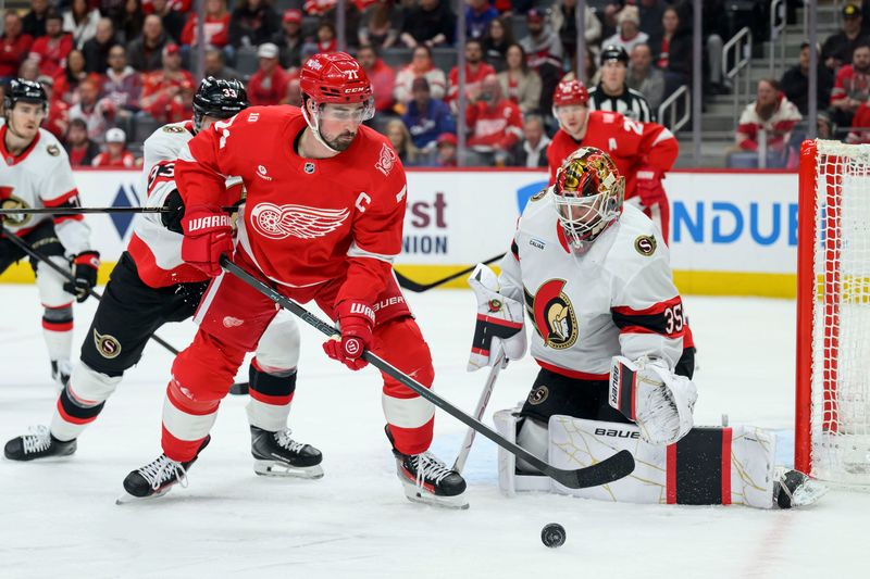 Detroit center Dylan Larkin tries to get the puck past Ottawa goaltender Linus Ullmark during the first period of a game between the Detroit Red Wings and the Ottawa Senators at Little Caesars Arena, in Detroit, March 24, 2026.