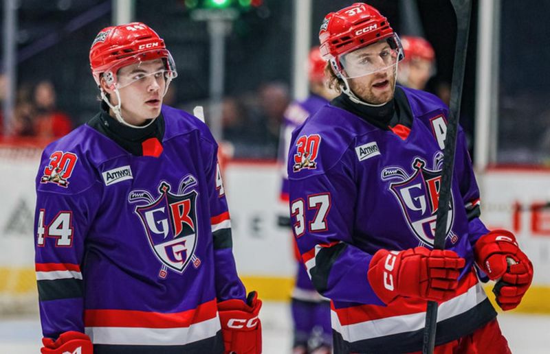 Grand Rapids defensemen Axel Sandin-Pellikka, left, and William Lagesson take a break during a 5-4 OT loss against Milwaukee on Tuesday in Grand Rapids.