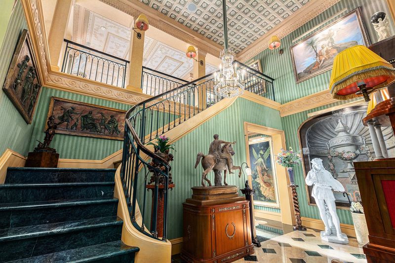 The staircase at 414 S. Main St. in downtown Ann Arbor, a 5,000-square-foot, two-story penthouse listed for $7 million includes most furnishings valued at about $2 million.