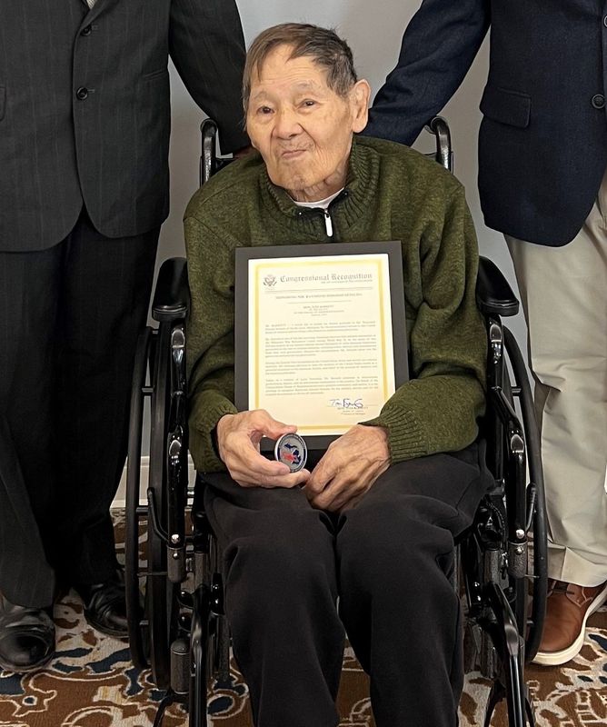 Raymond Setsuda, a Korean War veteran and South Lyon resident, received congressional recognition and a challenge coin on March 21, 2026, for his military service and patriotism.