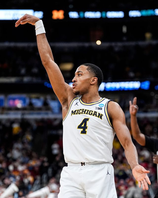Michigan guard Nimari Burnett (4) attempts a 3-pointer against Alabama during the second half of NCAA Tournament Sweet 16 round at United Center in Chicago on Friday, March 27, 2026.