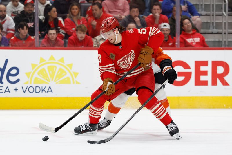 Detroit Red Wings defenseman Moritz Seider (53) skates with the puck in the first period against the Philadelphia Flyers at Little Caesars Arena in Detroit on Saturday, March 28, 2026.