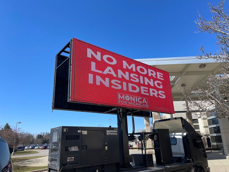 This mobile billboard outside the Michigan state Republican Party nominating convention on March 28, 2026 promoted Monica Yatooma's bid to be the party's nominee for Secretary of State. It didn't work. Delegates selected Macomb County Clerk Anthony Forlini.