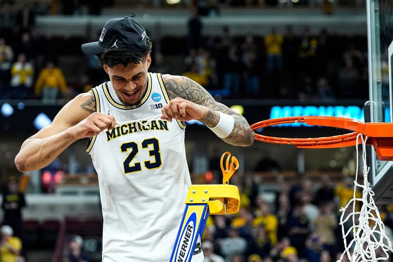 Michigan forward Yaxel Lendeborg (23) celebrates after winning the NCAA Tournament Midwest Regional Champion by defeating Tennessee 95-62 rat United Center in Chicago on Sunday, March 29, 2026.