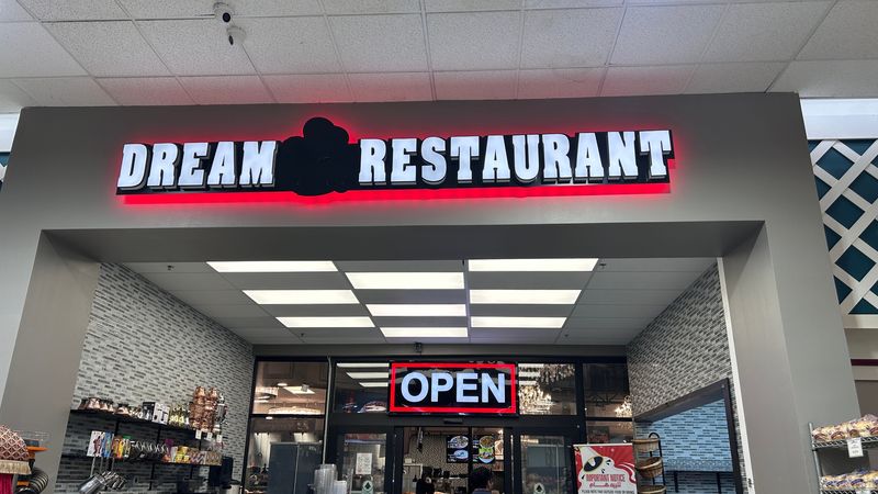 Dream Restaurant has a cafeteria style of service. Guests will pay first at each station, then either enjoy their meal at home or at one of the restaurant's booths or tables.