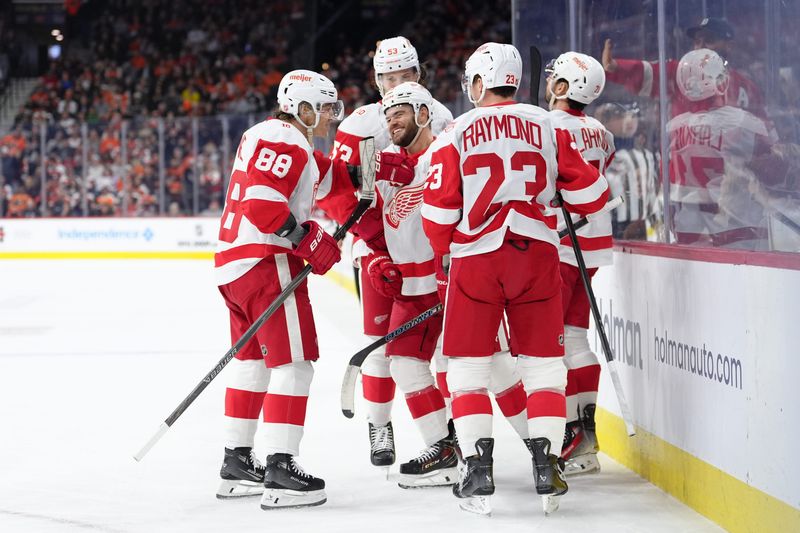 Detroit Red Wings right wing Alex Debrincat (93) celebrates with teammates after scoring a goal against the Philadelphia Flyers in the first period at Xfinity Mobile Arena in Philadelphia on Thursday, April 2, 2026.