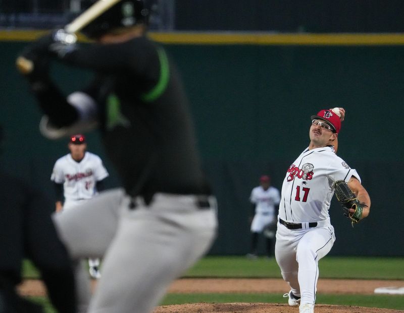 Lugnut's pitcher Samuel Dutton throws against the Dayton Dragons, Thursday, April 2, 2026, during the season-opener at Jackson Field in Lansing. Dayton won 8-7.