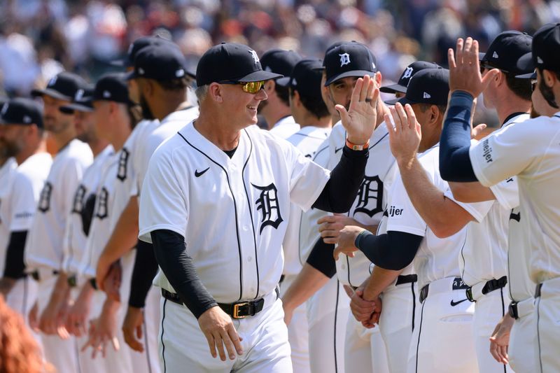 Detroit manager A.J. Hinch high-fives his players before the start of the home opener against the St. Louis Cardinals, at Comerica Park, in Detroit, April 3, 2026.