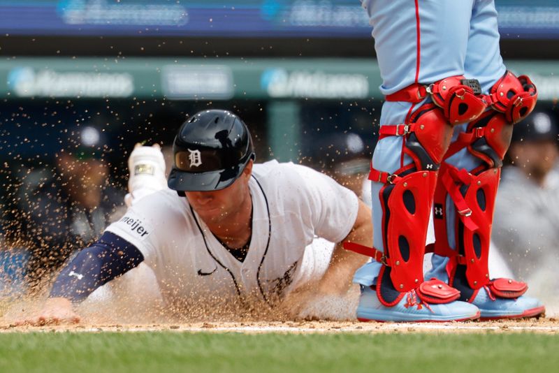 Detroit Tigers second baseman Colt Keith (33) dives in safe at home in the first inning against the St. Louis Cardinals at Comerica Park.