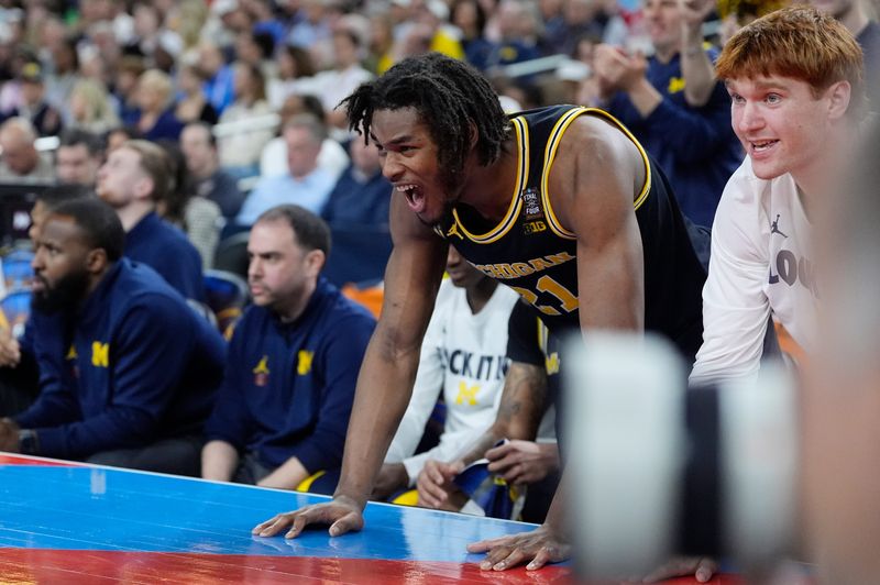Michigan forward Morez Johnson Jr. (21) reacts to a play in the first half of their Final Four game against Arizona at Lucas Oil Stadium in Indianapolis on Saturday, April 4, 2026.