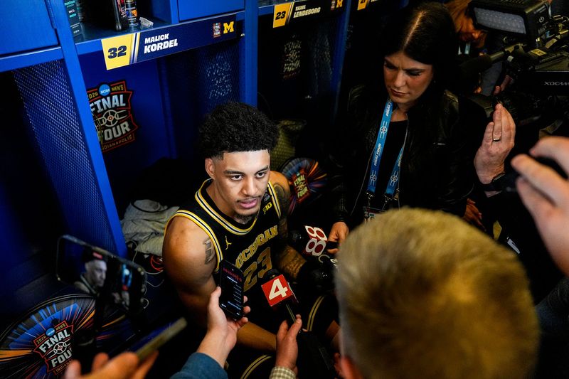 Michigan forward Yaxel Lendeborg (23) answers questions in the locker room after 91-73 win over Arizona at the Final Four game at Lucas Oil Stadium in Indianapolis on Saturday, April 4, 2026.