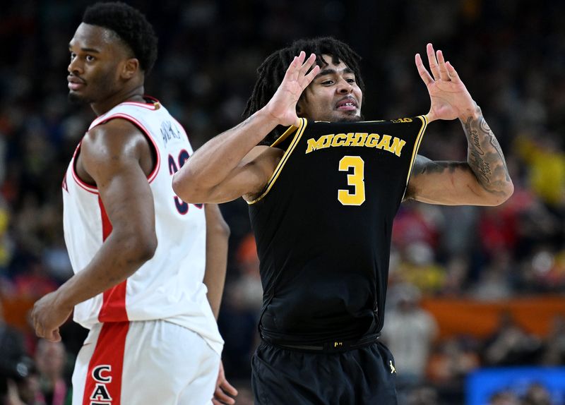 Michigan guard Elliot Cadeau (3) reacts in the second half as Michigan takes on Arizona in the NCAA men’s basketball championship semifinal at Lucas Oil Stadium on April 4, 2026 in Indianapolis.