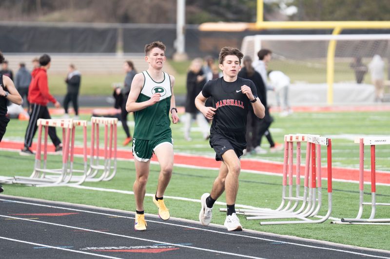 Marshall and Pennfield runners compete during a meet at Marshall High School on Friday, March 24, 2026.