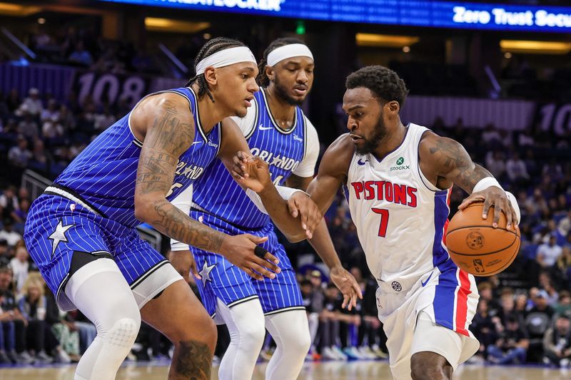 Detroit Pistons forward Paul Reed drives to the basket against Orlando Magic forward Paolo Banchero during the first quarter at Kia Center, Monday, April 6, 2026 in Orlando.