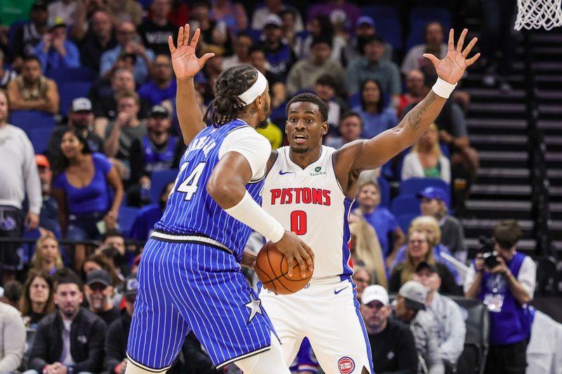 Detroit Pistons center Jalen Duren (0) defends Orlando Magic center Wendell Carter Jr. (34) during the first quarter at Kia Center in Orlando on Monday, April 6, 2026.