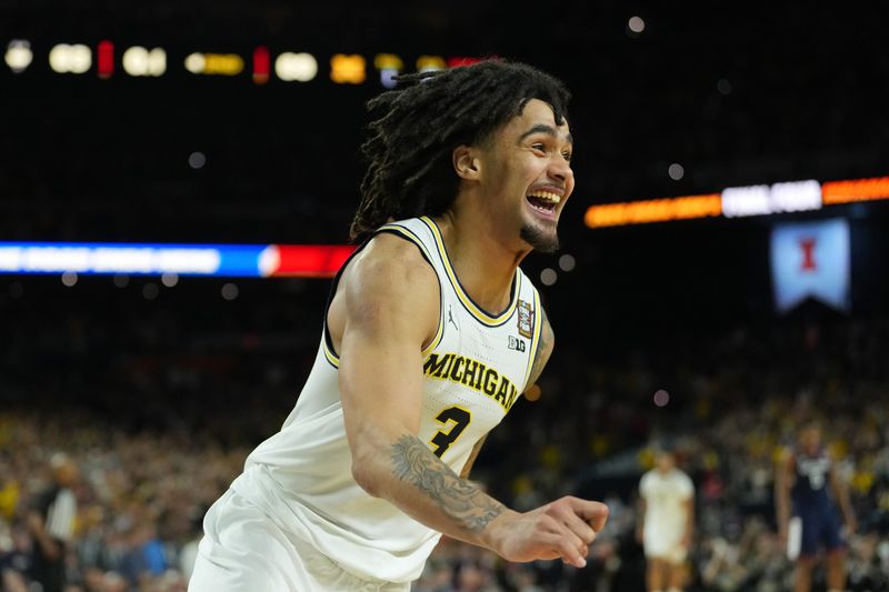 Michigan Wolverines guard Elliot Cadeau (3) celebrates after their win against the UConn Huskies in the national championship of the Final Four of the men's 2026 NCAA Tournament between the and the Michigan Wolverines at Lucas Oil Stadium.