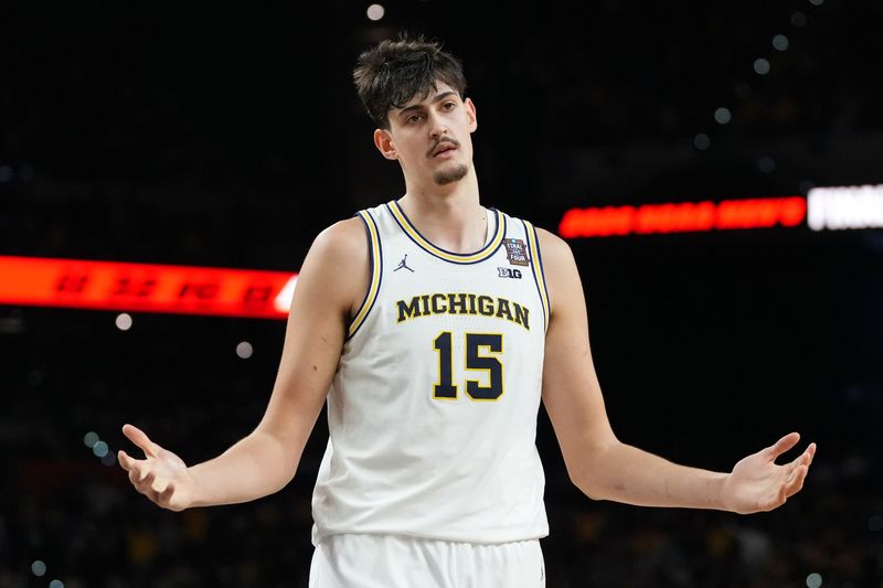 Apr 6, 2026; Indianapolis, IN, USA; Michigan Wolverines center Aday Mara (15) reacts after a play against the UConn Huskies during the first half in the national championship of the Final Four of the men's 2026 NCAA Tournament between the and the Michigan Wolverines at Lucas Oil Stadium. Mandatory Credit: Bob Donnan-Imagn Images