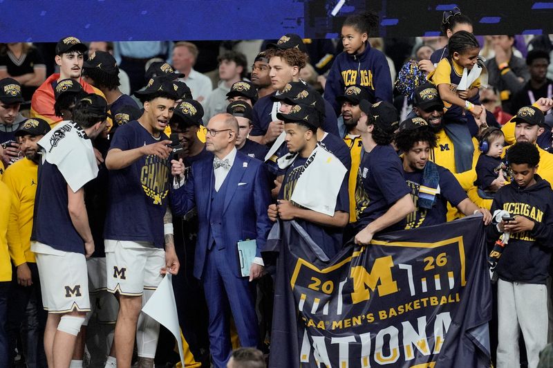 Michigan celebrates winning the NCAA national championship against Connecticut at Lucas Oil Stadium in Indianapolis on Monday, April 6, 2026.