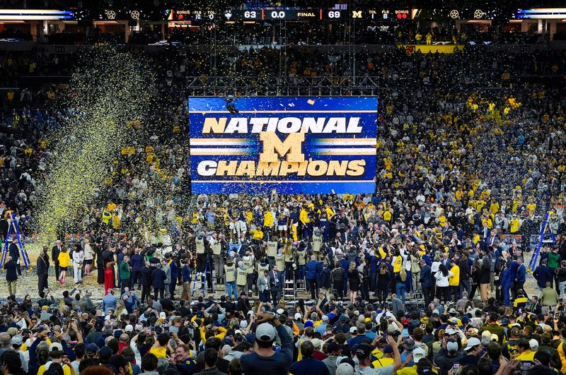 Michigan celebrates winning the NCAA national championship against Connecticut at Lucas Oil Stadium in Indianapolis on Monday, April 6, 2026.