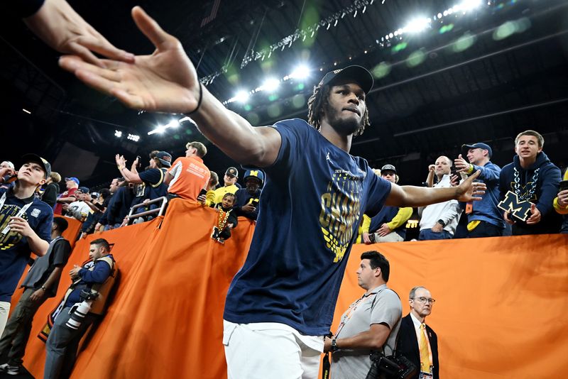 Michigan forward Morez Johnson Jr. (21) averaged 13.1 points and 7.3 rebounds in 25.1 minutes per game this past season.