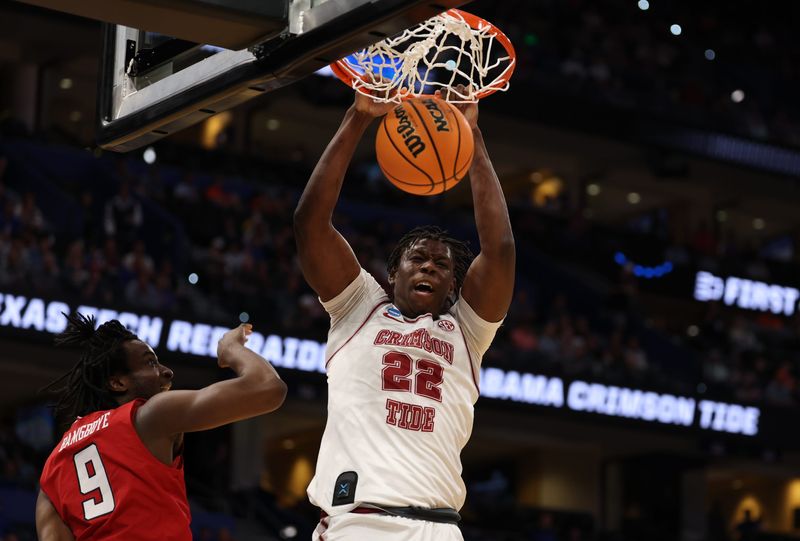Mar 22, 2026; Tampa, FL, USA; Alabama Crimson Tide forward Aiden Sherrell (22) dunks past Texas Tech Red Raiders forward Luke Bamgboye (9) in the first half during a second round game of the men's 2026 NCAA Tournament at Benchmark International Arena. Mandatory Credit: Matt Pendleton-Imagn Images