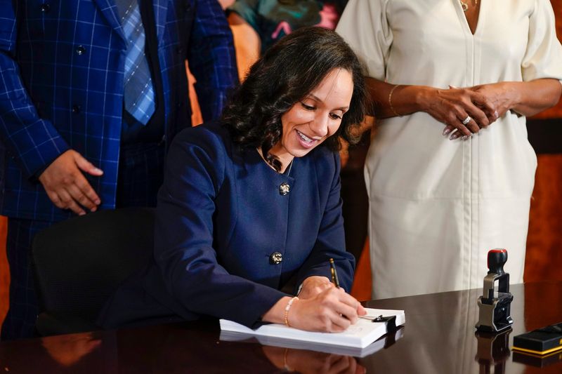 Detroit Mayor Mary Sheffield signs her first City Council-adopted budget in a conference room near her office in the Coleman A. Young Municipal Center in Detroit on Wednesday, April 8, 2026.
