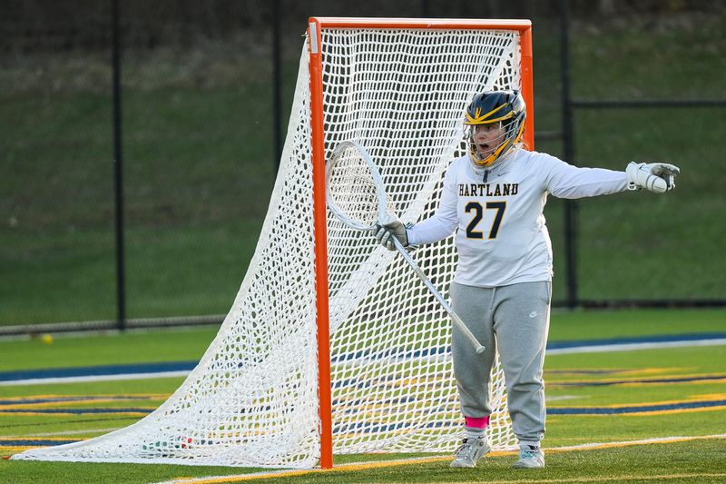 Hartland’s Claire Pielack communicates with teammates while guarding the goal during the team’s game against Detroit Country Day on Wednesday, April 8, 2026 in Hartland.
