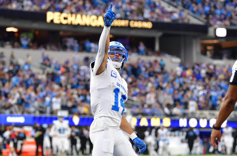 Dec 14, 2025; Inglewood, California, USA; Detroit Lions wide receiver Amon-Ra St. Brown (14) celebrates after a touchdown during the second quarter against the Los Angeles Rams at SoFi Stadium. Mandatory Credit: Gary A. Vasquez-Imagn Images