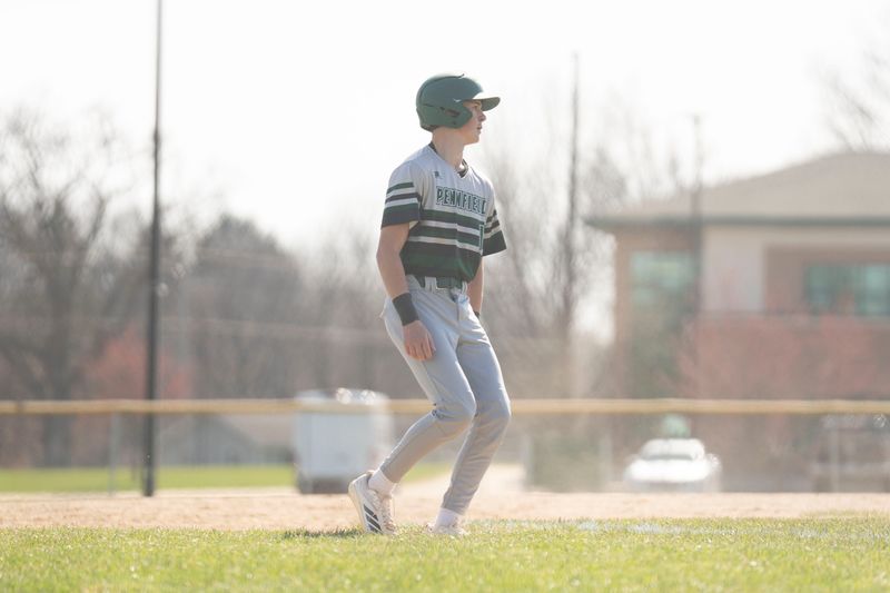 Pennfield's Brady Conley reaches third base during a game against Hillsdale at Pennfield High School on Thursday, April 9, 2026.
