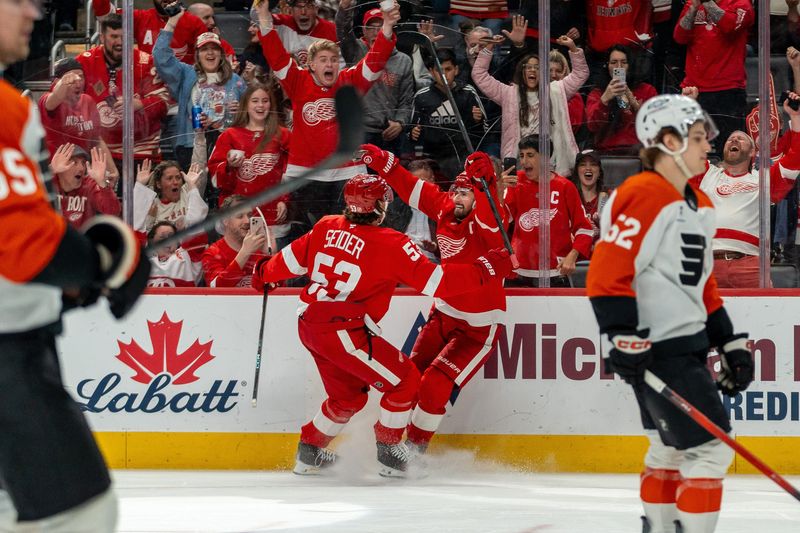 Dylan Larkin (71) of the Detroit Red Wings celebrates after scoring a hat trick in the third period against the Philadelphia Flyers at Little Caesars Arena in Detroit on Thursday, April 9, 2026.