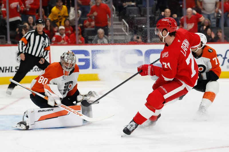 Mar 28, 2026; Detroit, Michigan, USA; Detroit Red Wings center Dylan Larkin (71) scores on Philadelphia Flyers goaltender Dan Vladar (80) in the second period at Little Caesars Arena. Mandatory Credit: Rick Osentoski-Imagn Images