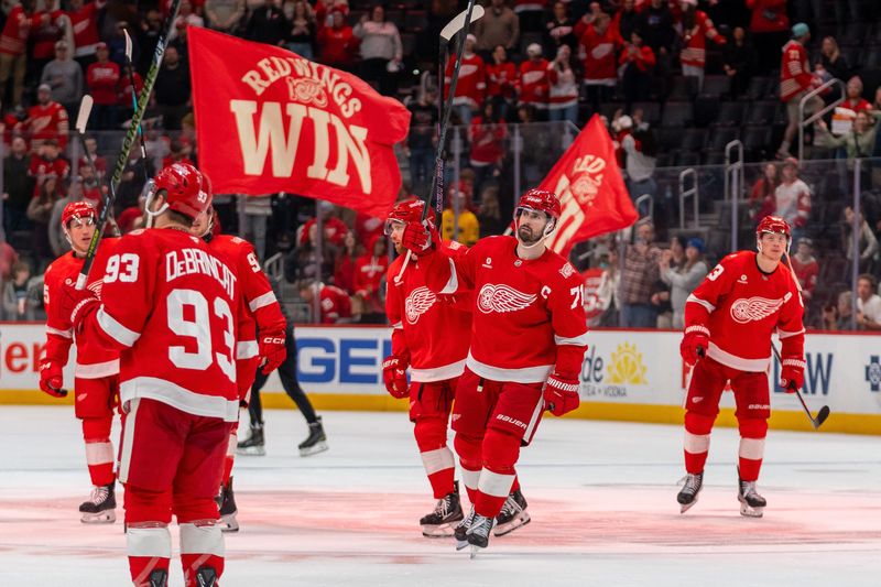 Dylan Larkin (71) of the Detroit Red Wings celebrates with his teammates after defeating the Philadelphia Flyers 6-3 at Little Caesars Arena in Detroit on Thursday, April 9, 2026.