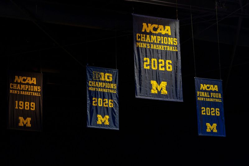 A banner recognizing the Michigan Wolverines as NCAA men’s basketball national champions hangs inside the Crisler Center in Ann Arbor on Saturday, April 11, 2026.