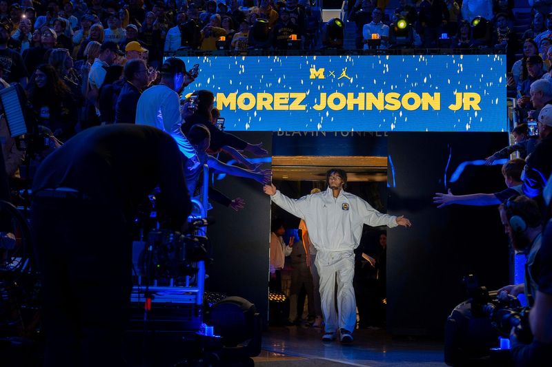 Michigan Wolverines player Morez Johnson Jr. walks through the tunnel during a national championship celebration at Crisler Center in Ann Arbor on Saturday, April 11, 2026.